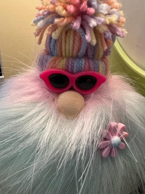 gnome wearing pink glasses